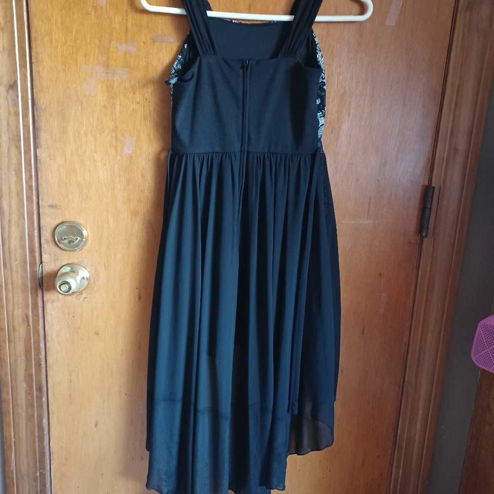 Amy's closet size 12 black and white dress. Long in the back, short in the front